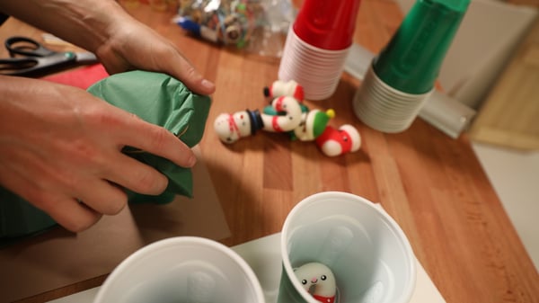 holiday party games - rubber band on cups